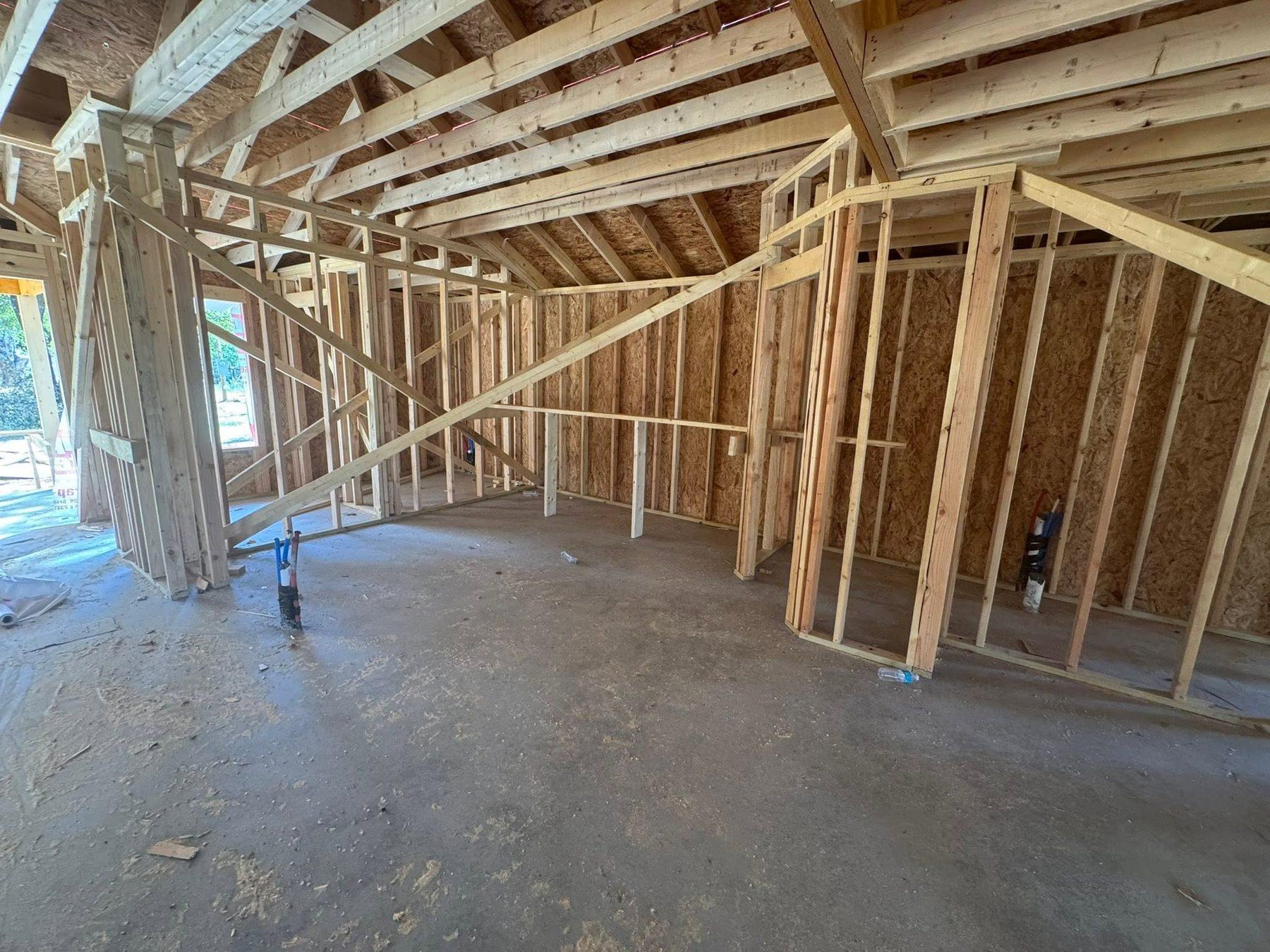Interior framing and roof trusses of a home under construction