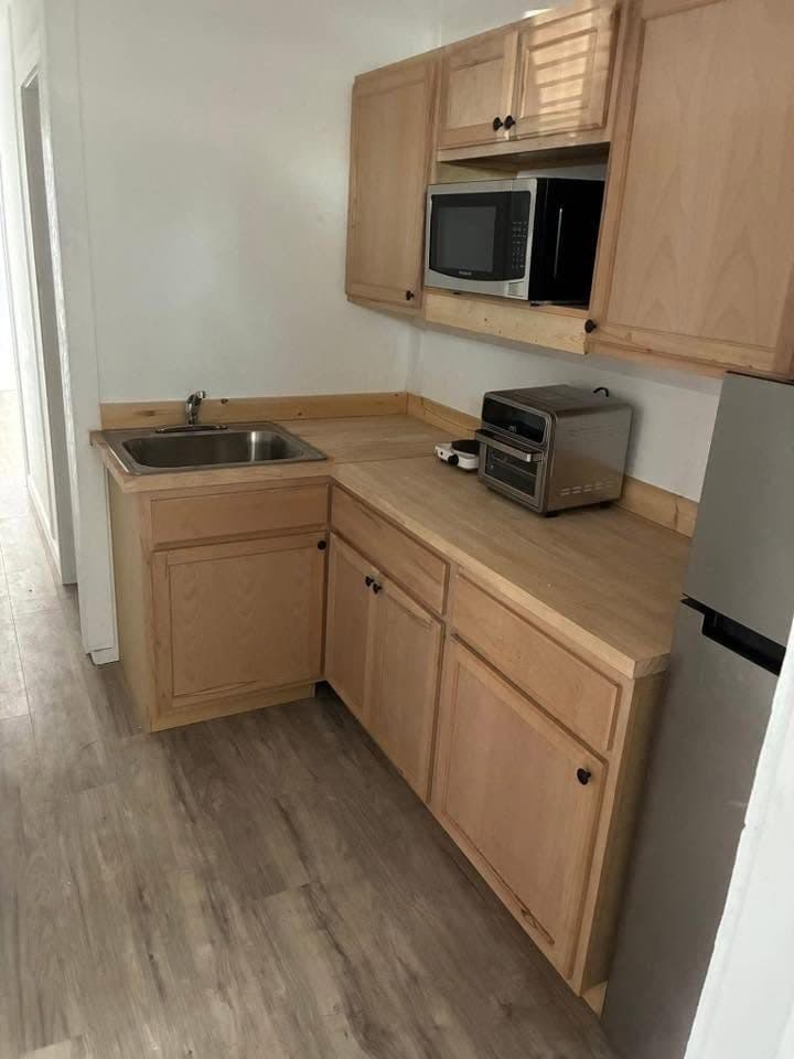 Galley kitchen and hallway inside a container unit
