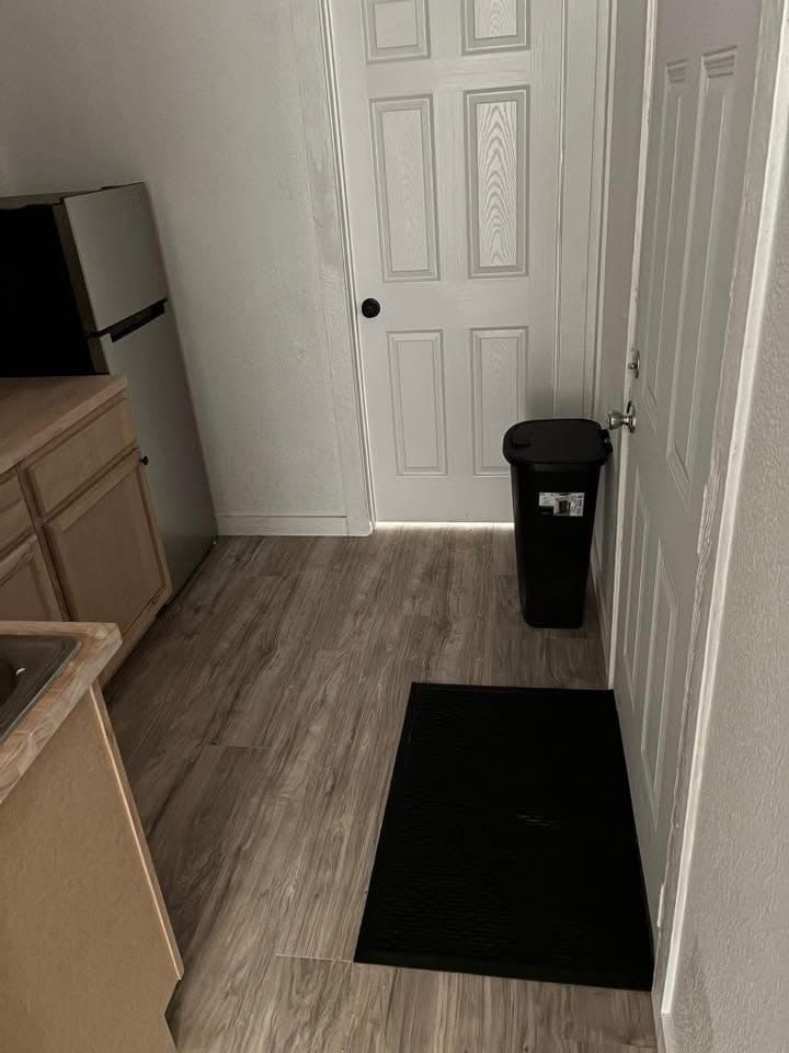 Entry door and kitchen counter inside a container unit
